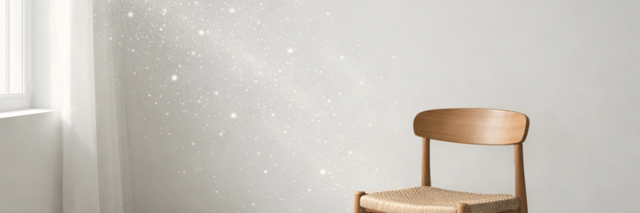 Wooden chair with woven seat near sunlit window in minimalist room