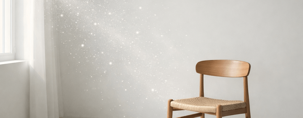 Wooden chair with woven seat near sunlit window in minimalist room